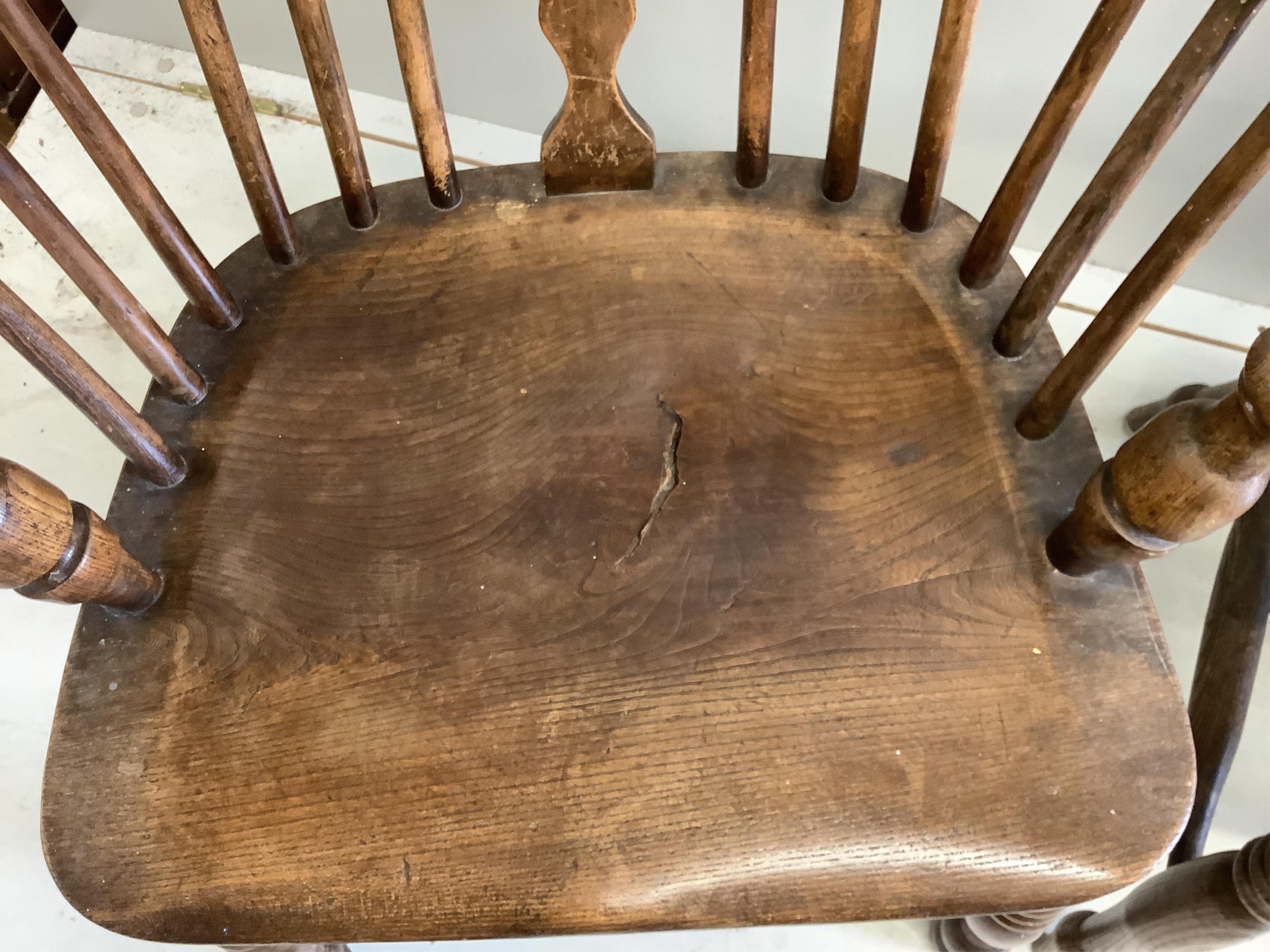 A harlequin set of four 19th century ash, elm and beech Windsor elbow chairs, largest width 60cm, depth 36cm, height 95cm. Condition - fair